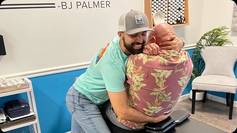 Dr. Patrick Bain caring for a patient at SpringBack Chiropractic